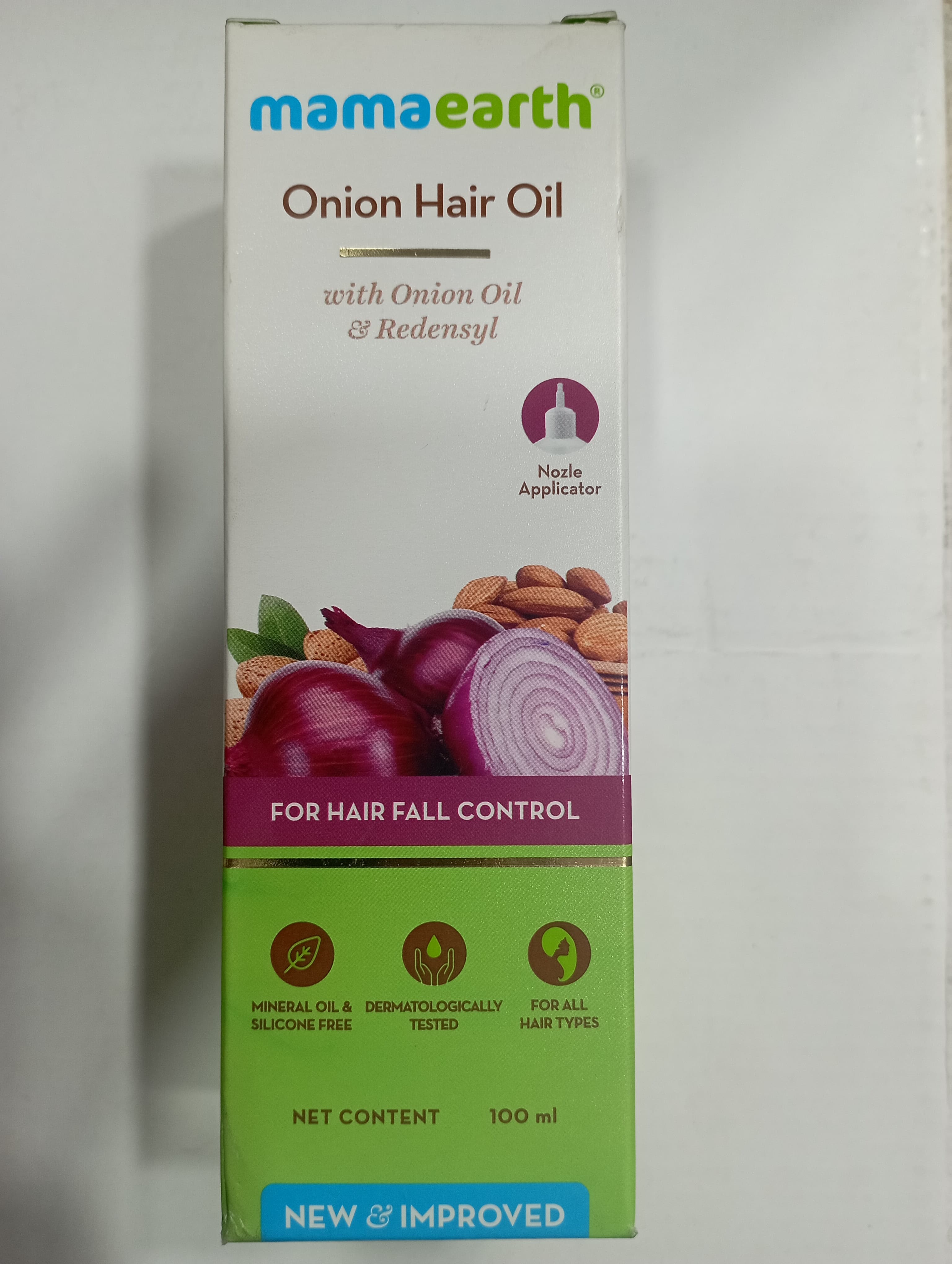 Mamaearth® Onion hair oil With onion oil & redensyl For hair fall control Mineral oil & dermatologically Silicone free Tested Nozle Applicator Net content For all Hair types 100 ml New & improved